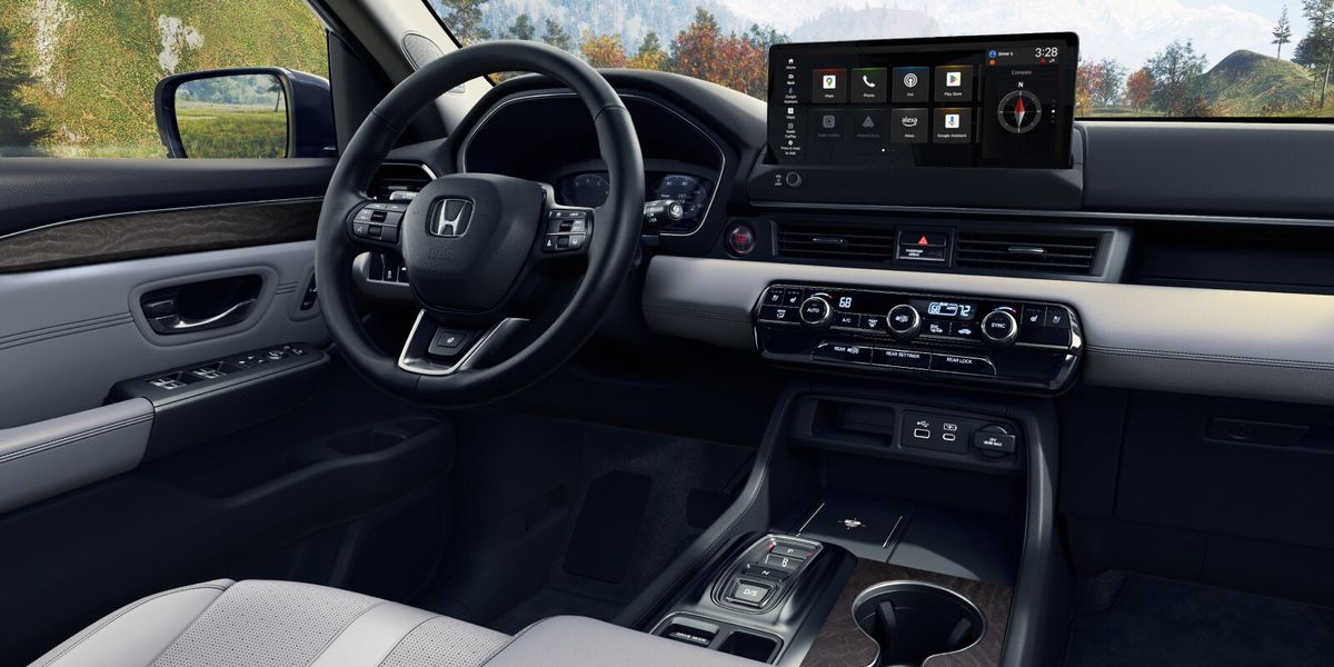2026 Honda Pilot Elite shown with Gray Leather with the screen